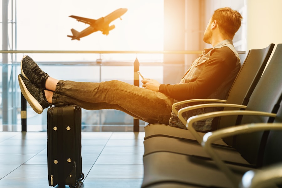 Traveller relaxing at the gate while a plane takes off